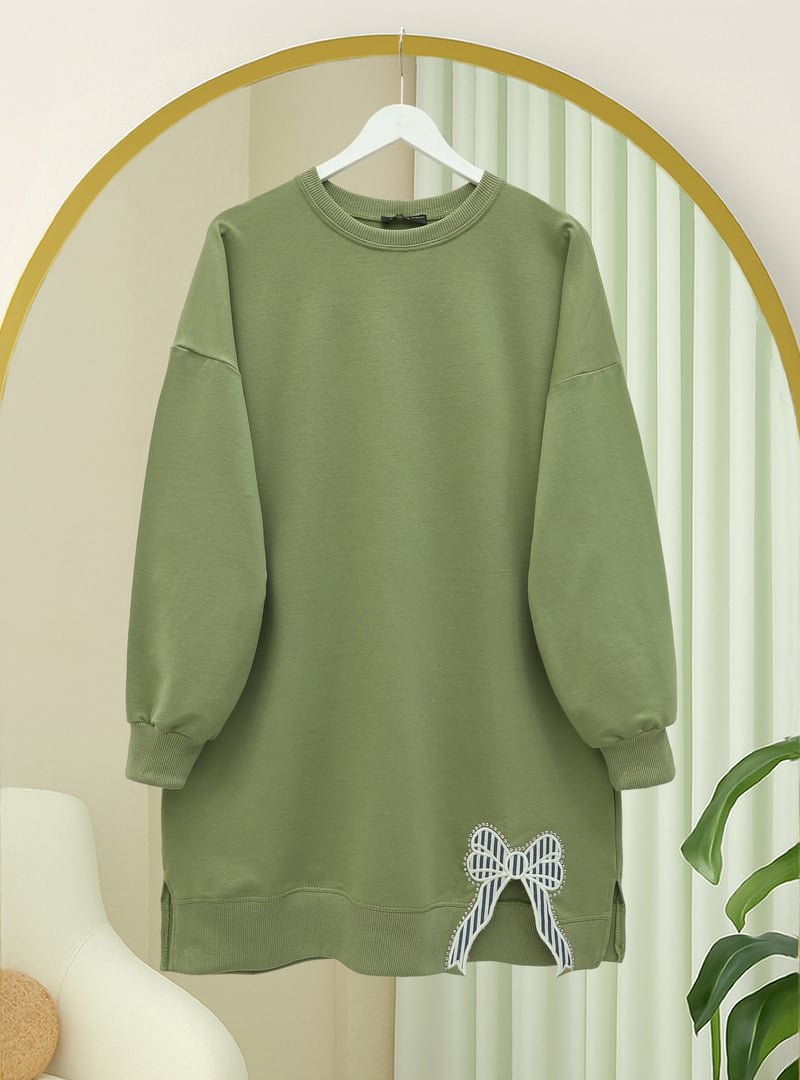 Podyumplus Çağla Y. Yuvarlak Yaka Eteği Fiyonk Detaylı Salaş Penye Tunik Podyumplus Çağla Y. Yuvarlak Yaka Eteği Fiyonk Detaylı Salaş Penye Tunik