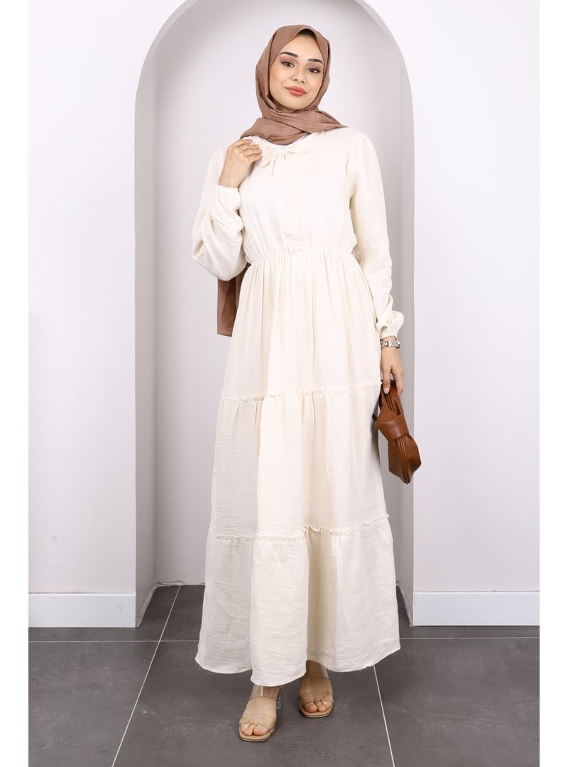 İmaj Butik Bej Yaka Bağlamalı Eteği Katlı Muslin Elbise İmaj Butik Bej Yaka Bağlamalı Eteği Katlı Muslin Elbise
